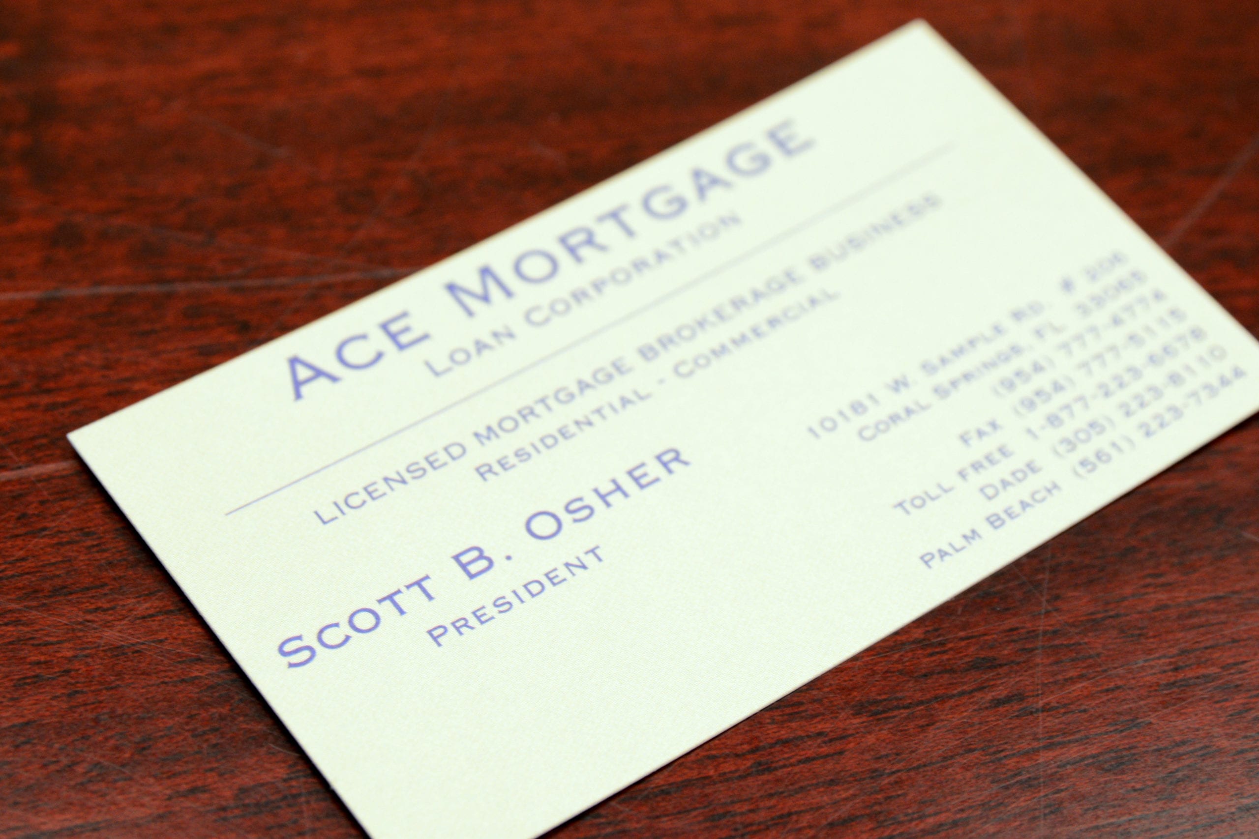Mortgage advisor explaining loan details to a couple in an office