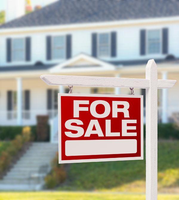 For sale sign in front of a home