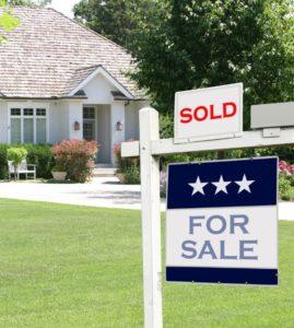 Home for sale with a sold sign