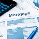 Mortgage document, pen, and calculator