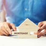 mortgage concept, wooden block home