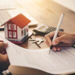 A client signing home financing papers