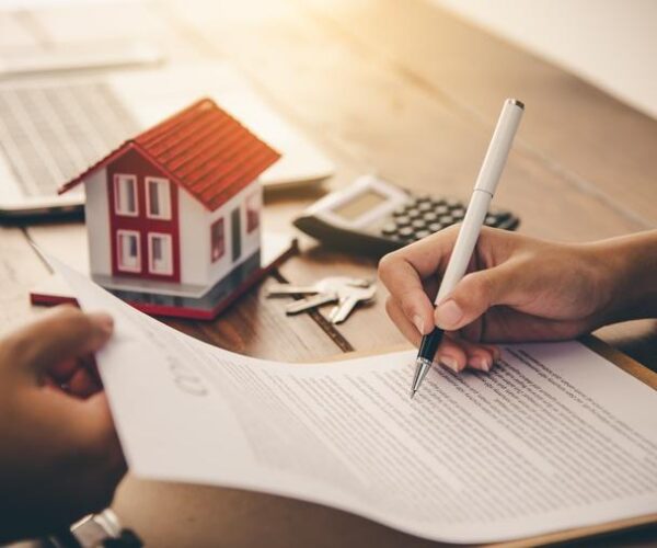 A client signing home financing papers