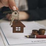 Mortgage lender giving home keys to client