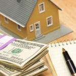 coral springs down payment concept - House and Money with Pad of Paper and Pen