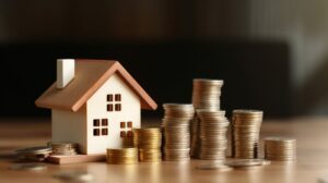 wooden house and money on a table- home financing