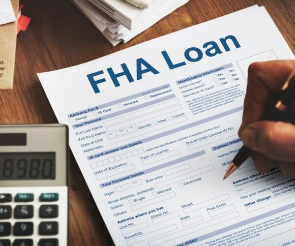 Client signing FHA Loan papers