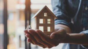 fha loan concept. hand holding house model