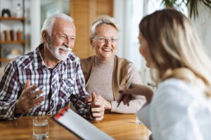 senior discussing reverse mortgage with an agent