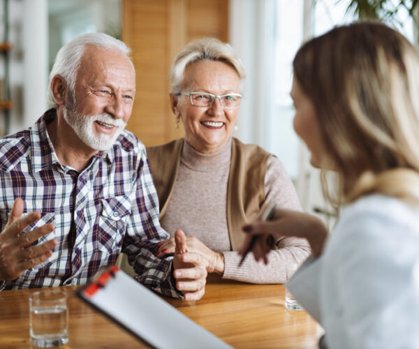 senior discussing reverse mortgage with an agent