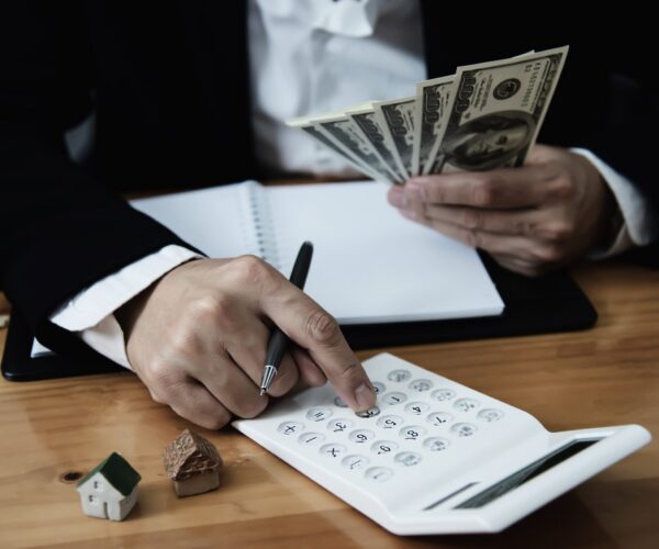 Business man show money bank note make financial plan invite people to sell or buy house and car - monetary properties loan credit insurance concept