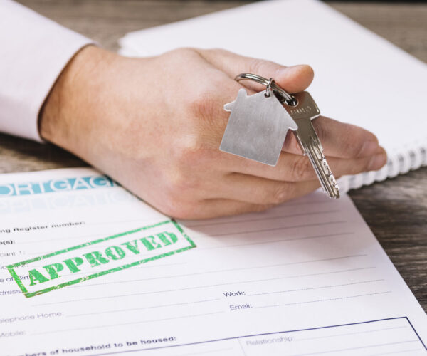 crop-man-giving-new-house-key