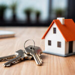 home mortgage concept - a house model and a key