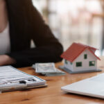 Woman reviewing mortgage and home buying documents